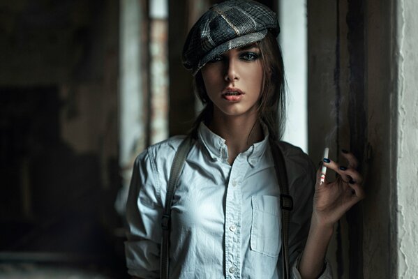 In the hallway, a girl in a white shirt and a cap