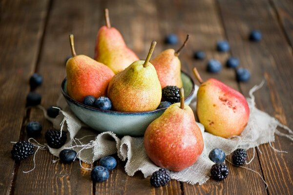 Still life with pears, blackberries and blueberries