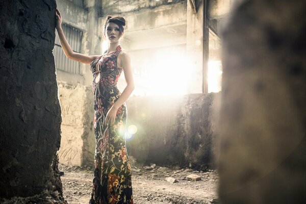 A girl on the background of a room of ruins