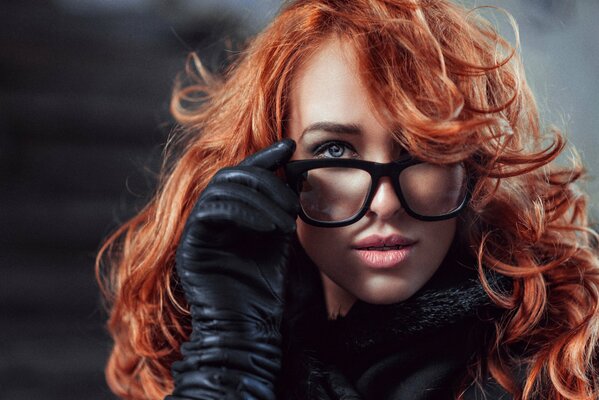 Portrait of red-haired Lydia with glasses