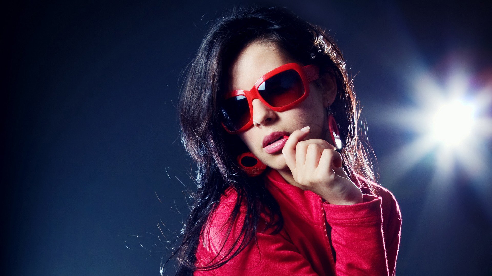 girl sunglasses red socket red earrings brunette red sweater lip