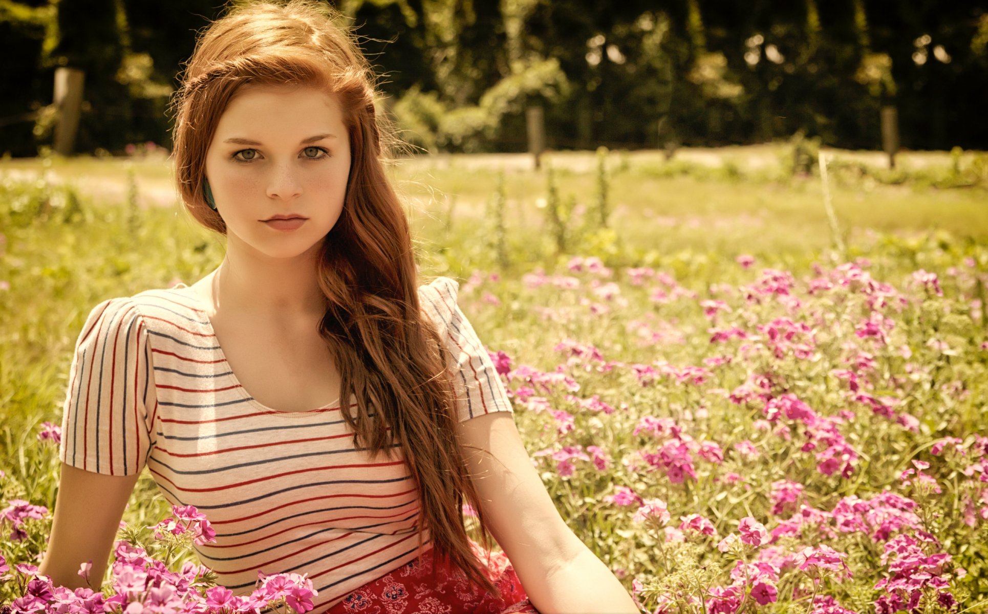 girl long-haired brown hair view grass flower