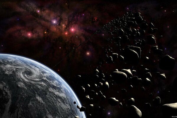 Asteroidi sullo sfondo dello spazio e del pianeta
