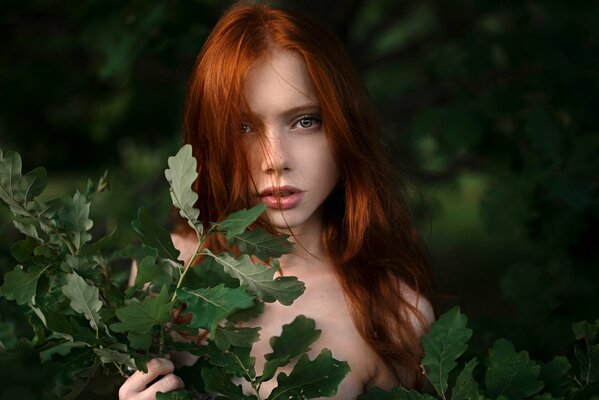A red-haired nymph among the greenery