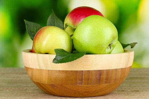 Green apples on a wooden table