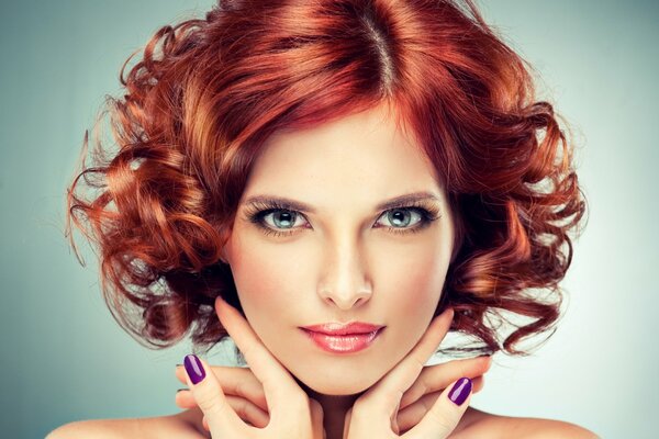 Red-haired girl with fillet manicure