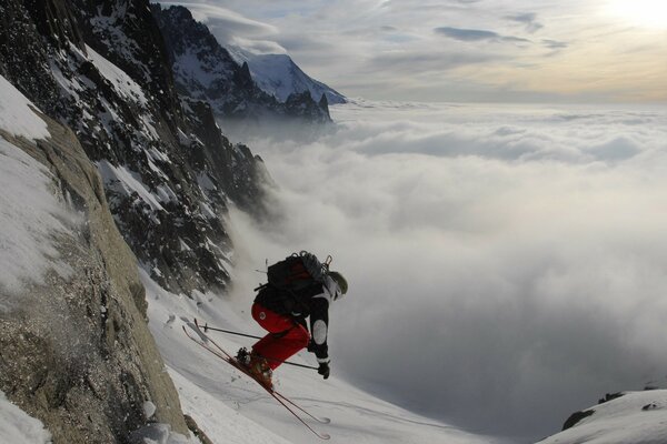 An athlete on skis goes down the mountain