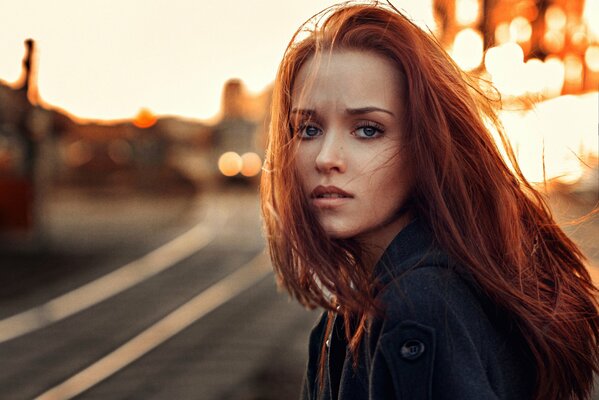 Portrait of a charming red-haired girl