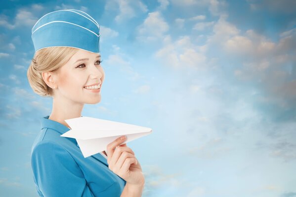 A stewardess girl with a paper airplane