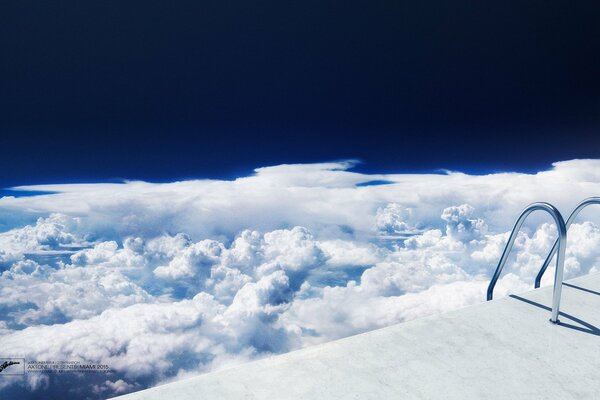 Descending the railing into the white clouds