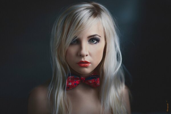 Beautiful girl with a red bow