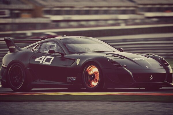 A black Ferrari car on the road