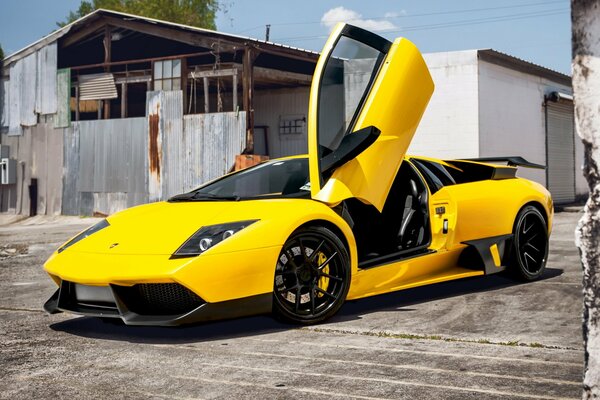 Yellow Lamborghini with the door open up