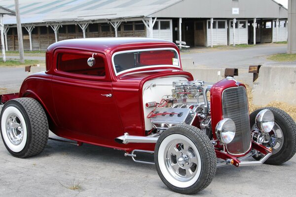 Red ford hod rod without hood with open engine