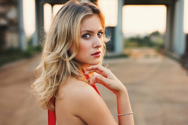 Portrait of a blonde in red clothes