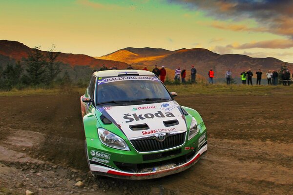 A sporty green car on the road