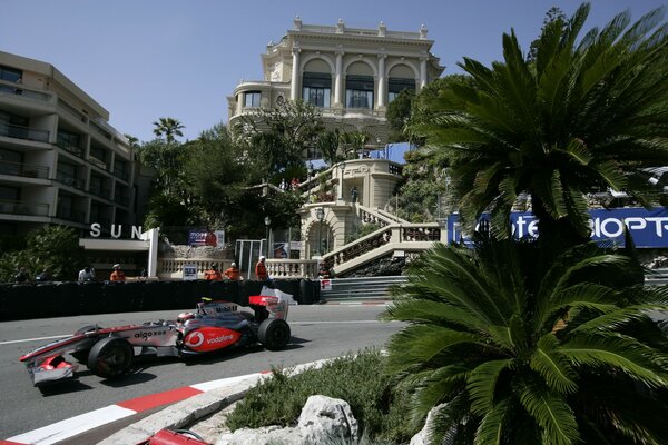 Racing car and palm trees on the background