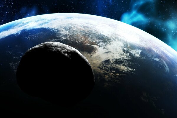 An asteroid approaching the planet in space