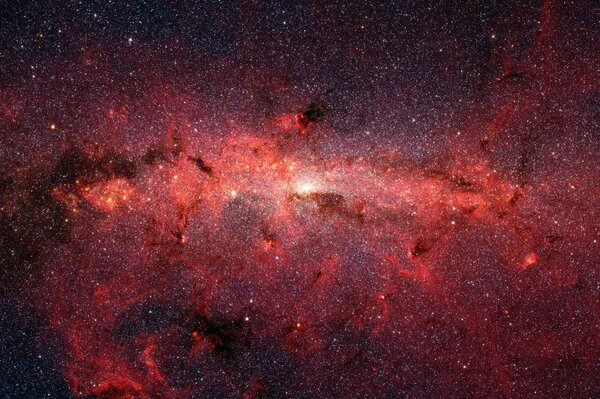 Many stars form a red glow in space