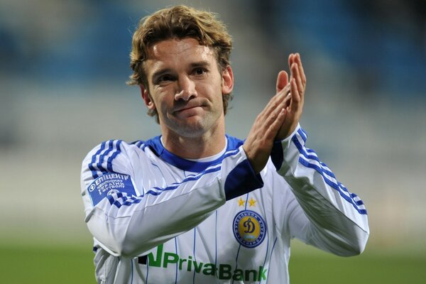 A football player clapping his hands on the football field