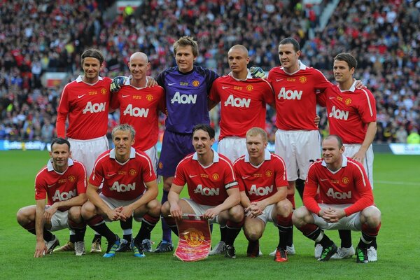 In the photo, the champions are Manchester United football players