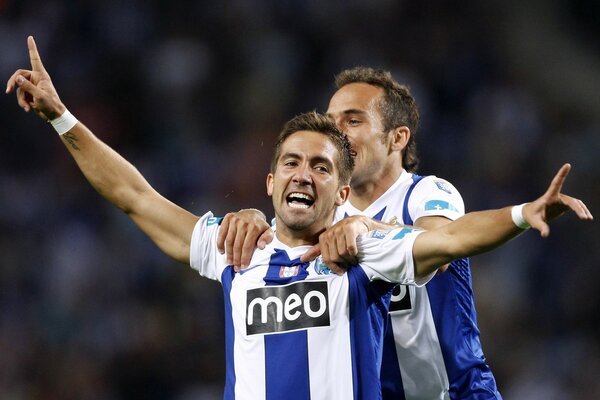 Portuguese football players on the field on a blurry background