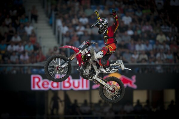 Incredible stunt on a motorcycle on the background of the stands