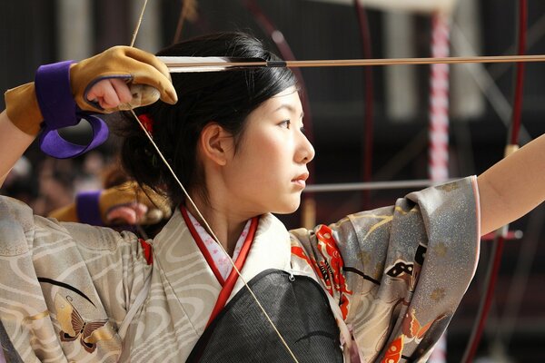 Japanese girl with a bow and arrow