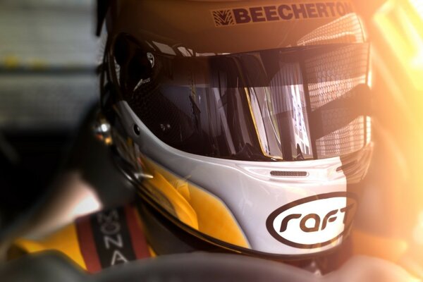 A racing driver in a helmet close-up