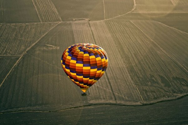 A balloon over the field from a bird s-eye view