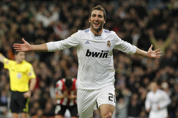 Football player in white Real Madrid uniform