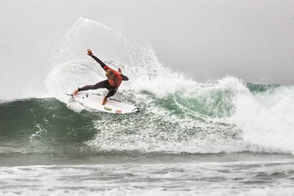 A man on a surfboard in the moment