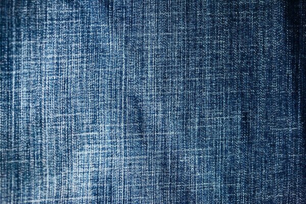 The photo shows a blue fabric with a dense texture