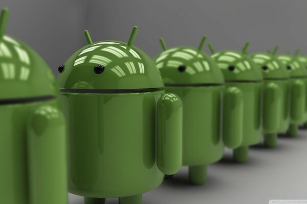 Painted construction of green androids