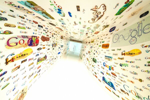 The walls are painted with colorful Google logos