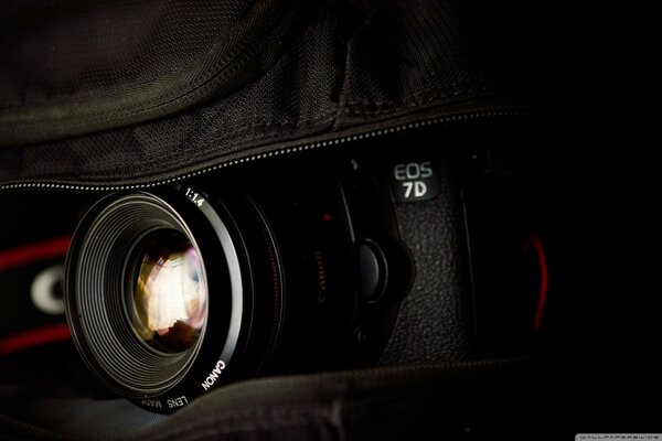 Canon eos camera on black background