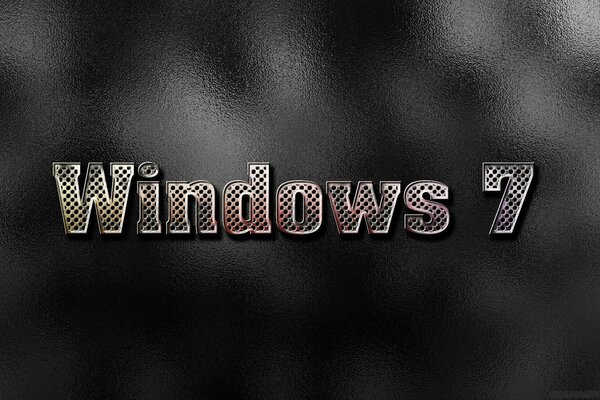Bild für den Bildschirmschoner von Windows 7 in großen Buchstaben in der Mitte vor dunklem Hintergrund