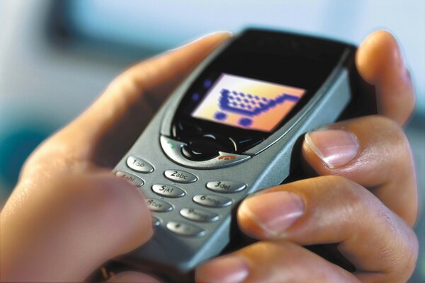 The old push-button phone as it lies in your hand