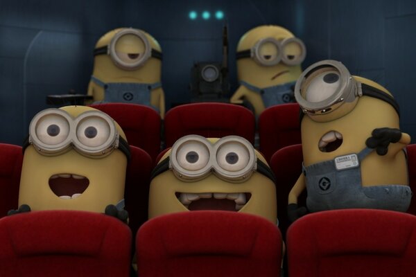 Minions in the cinema on bright chairs