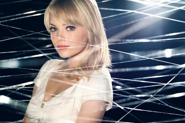 Emma Stone is a blonde in a spider s web. the marvel universe