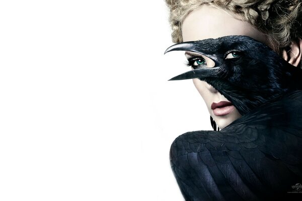 Charlize Theron with the black raven