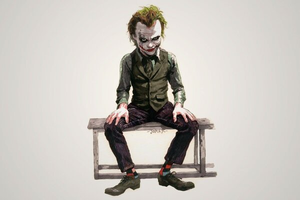 Joker assis sur un banc de parc