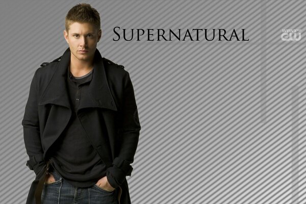 The supernatural. A handsome guy on a gray background