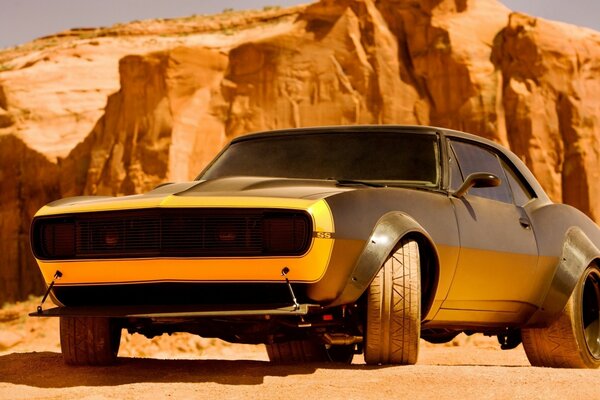 Corvette on the background of yellow mountains