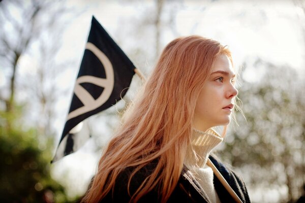 Beautiful blonde on a flag background