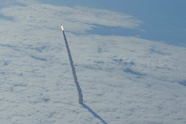 The launch of the shuttle into the stratosphere into space