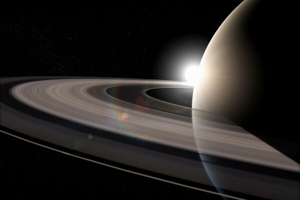 The solar circle rolls along the transparent rings of Saturn