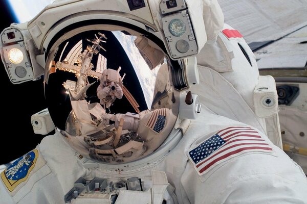 The space reflection in the spacesuit , the station