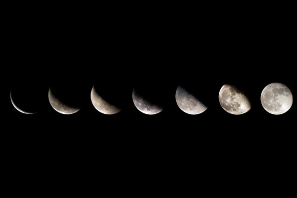 Fases de crecimiento de la Luna desde la Luna nueva hasta la Luna llena sobre un fondo negro