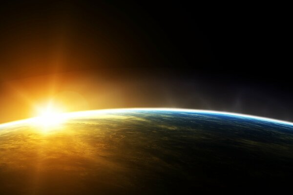 The sun rises from the horizon of the planet